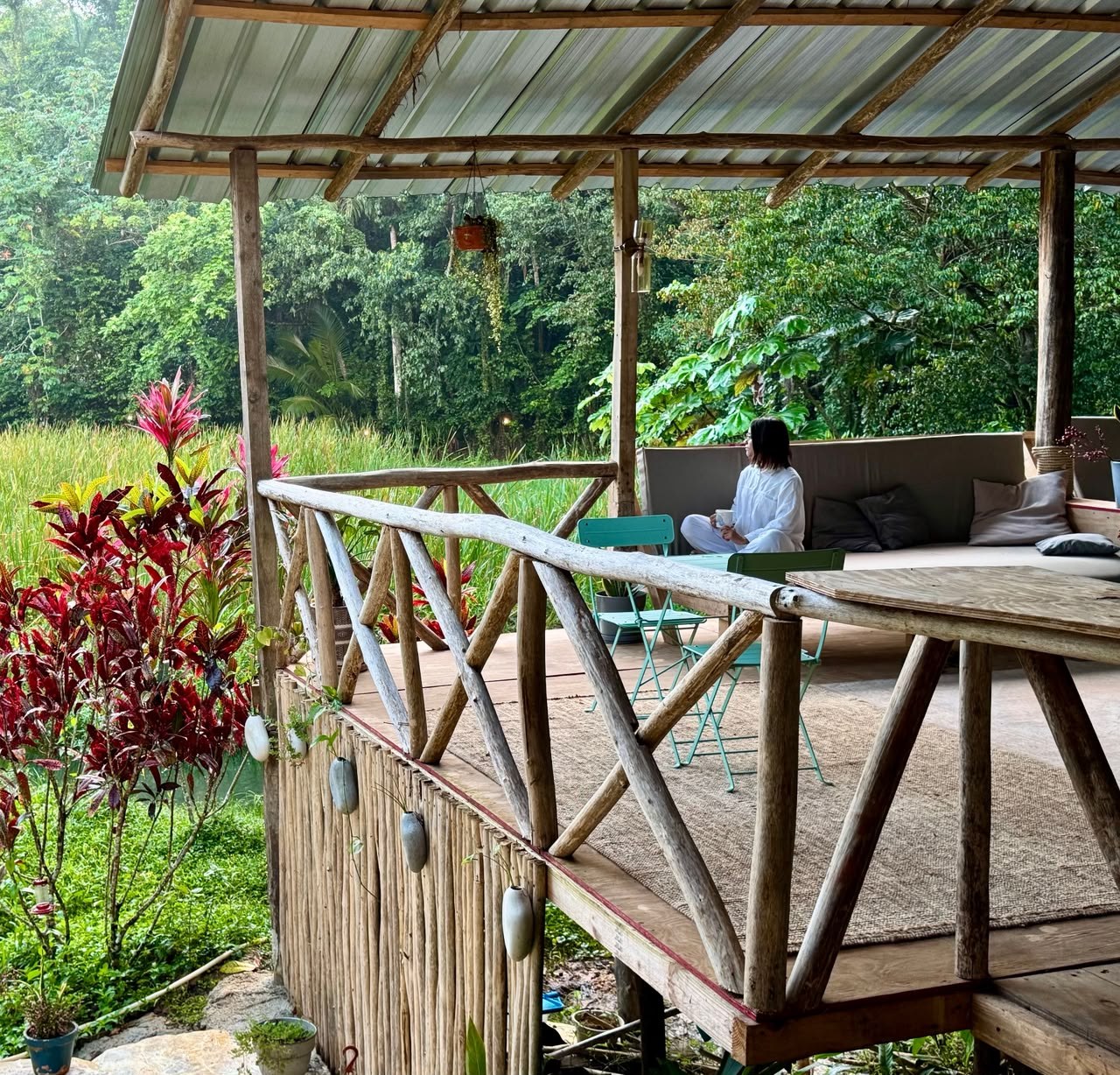 Meditation on a wooden deck surrounded by forest, Dominican Republic